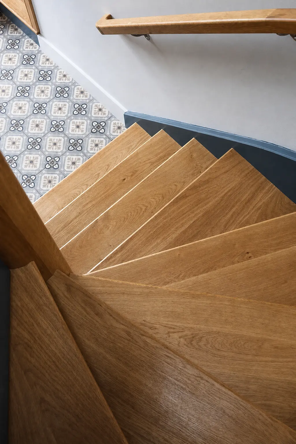 Bespoke oak winder staircase with a sculpted handrail, made in our Somerset workshop